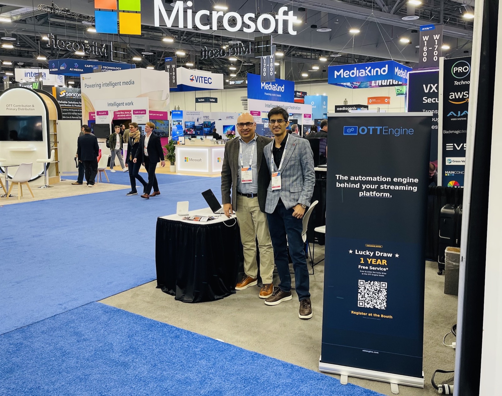 OTT Engine team at the NAB Show 2026 booth W1724 with the &lsquo;automation engine behind your streaming platform&rsquo; banner